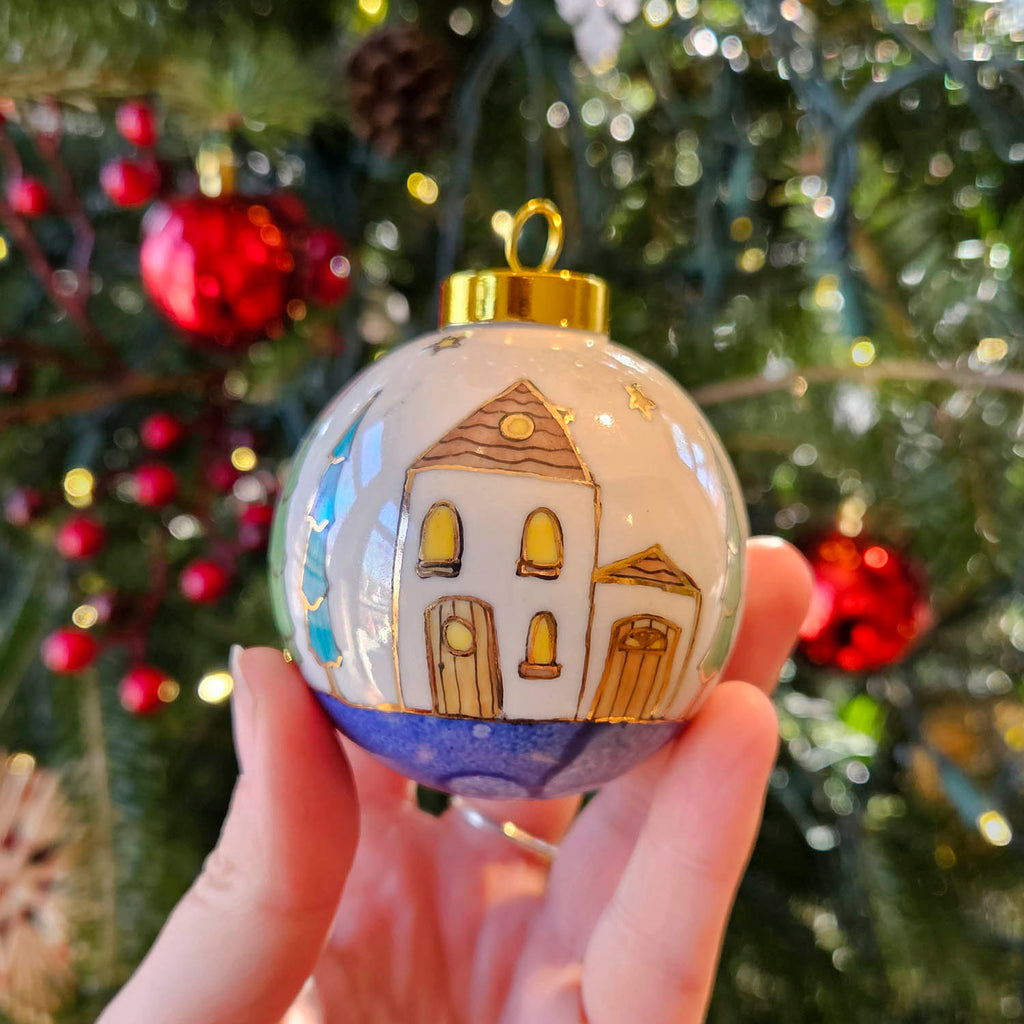Isabelle Lafargue artwork 'Christmas Ornament-Blue & White, Trees, White & Yellow House' at Gallery78 Fredericton, New Brunswick