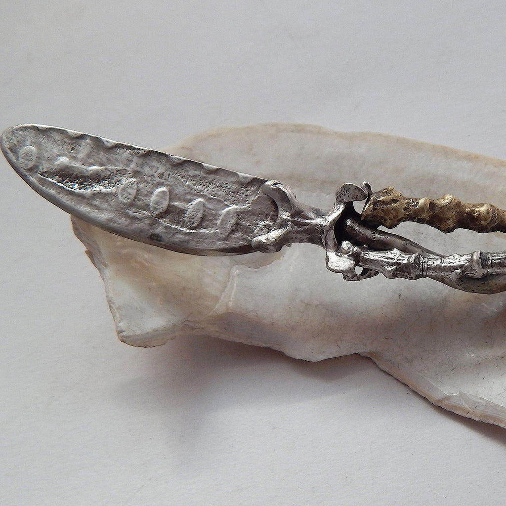 Clare Bridge artwork 'Paté Knife with Twigs & Vertebrae' at Gallery78 Fredericton, New Brunswick