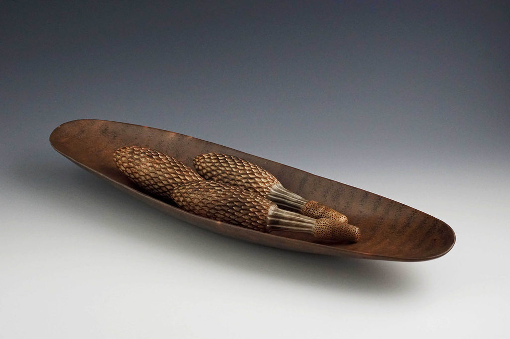 Judy Blake artwork 'Smoke-fired Seed Vessels in Pod Shell 1' at Gallery78 Fredericton, New Brunswick