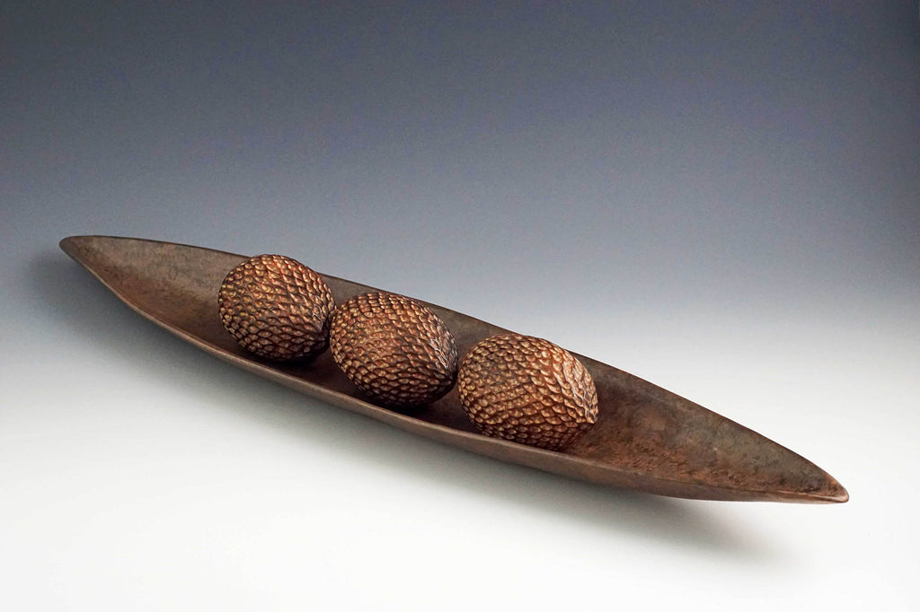 Judy Blake artwork 'Smoke-fired Seed Vessels in Pod Shell 2' at Gallery78 Fredericton, New Brunswick