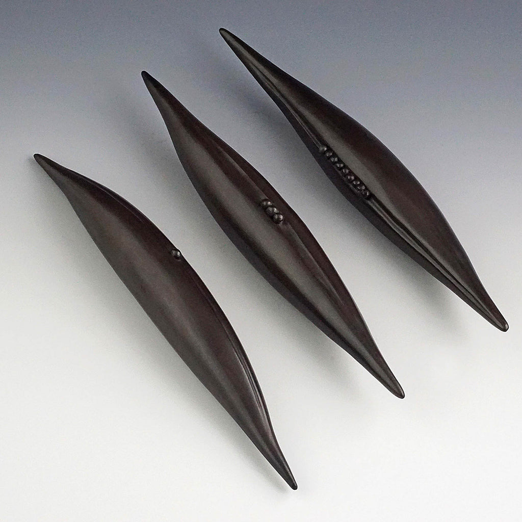 Judy Blake artwork 'Smoke-Fired Seed Pod - 1 seed' at Gallery78 Fredericton, New Brunswick