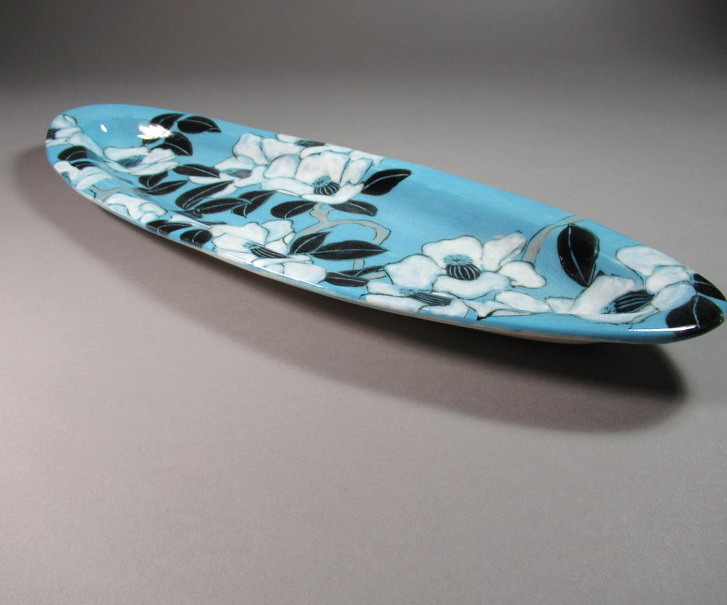 Karen Burk artwork 'Long Oval Platter - Turquoise with Camelia' at Gallery78 Fredericton, New Brunswick