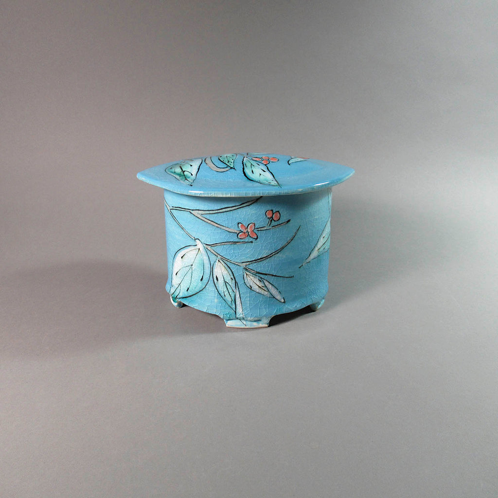 Karen Burk artwork 'Funerary Urn - Small Oval, Turquoise Blue Leaf and Berries' at Gallery78 Fredericton, New Brunswick