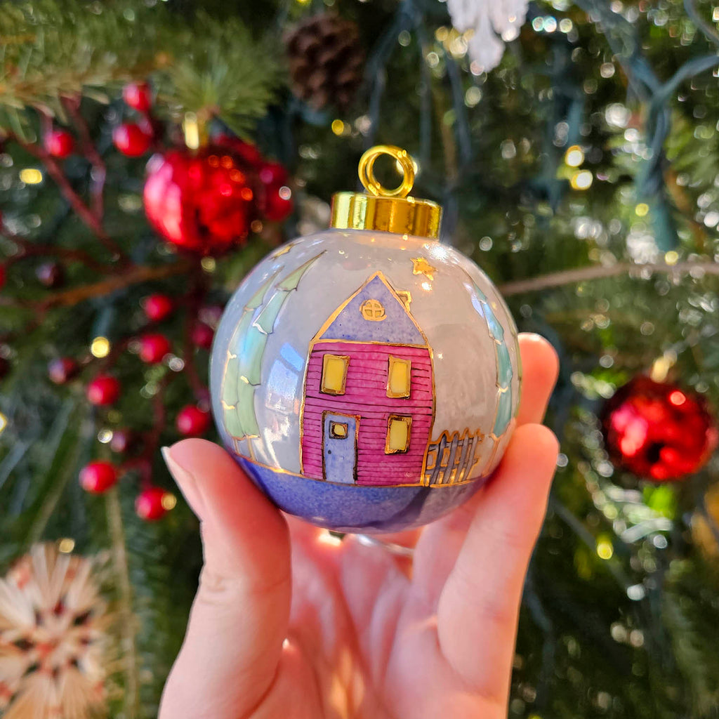 Isabelle Lafargue artwork 'Christmas Ornament - Blue, Trees, Pink and Yellow Houses' at Gallery78 Fredericton, New Brunswick